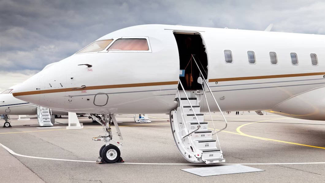 white-private-business-jet-open-ladder-airport