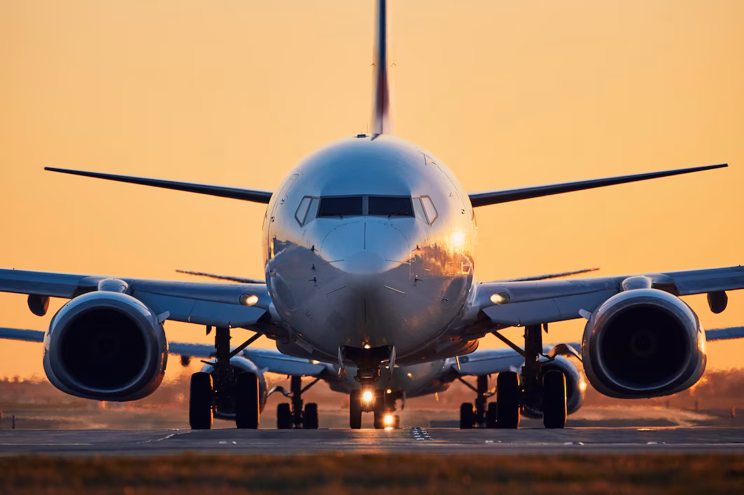airplane airport runway against clear sky sunset