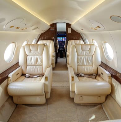 private jet interior with plush leather seating